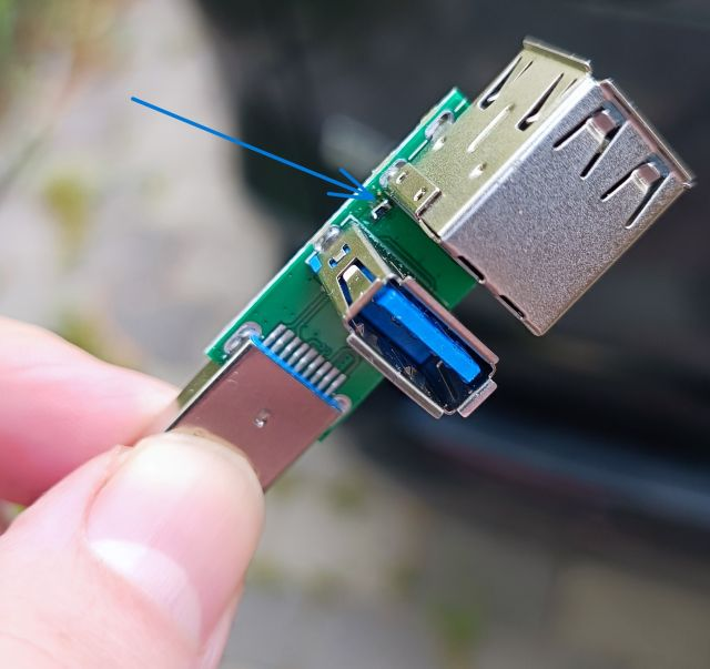 Modified USB hub PCB showing the series resistor